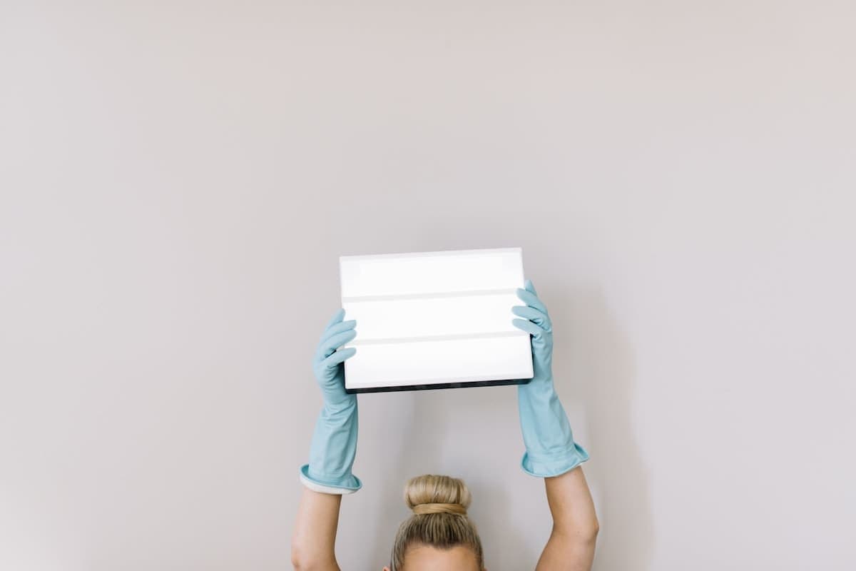 Cleaner vacuuming a living room on a residential cleaning job